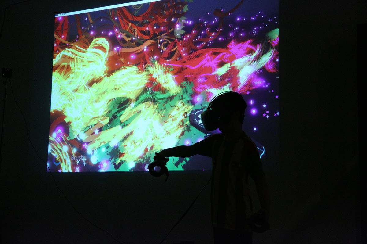 a silhouette of a person wearing VR goggles with a colorful pattern displayed
